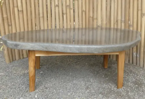 Product image of the product “table made of riverstone with wooden feet. size approx. 118x70x39 cm ”